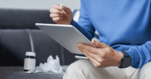 man using tablet video conference call with doctor telemedicine 1 1